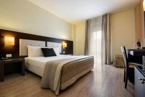 Postel nebo postele na pokoji v ubytování Hotel Executive + 37 fotografií