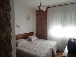 Postel nebo postele na pokoji v ubytování Arume