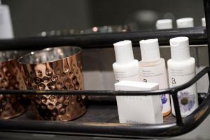 a group of bottles of moisturizers on a shelf at Castle Inn in West Lulworth