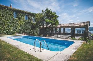 a swimming pool in front of a building at Rectoral de Cobres 1729 in San Adrian de Cobres