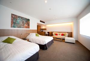 Letto o letti in una camera di Kinosaki Onsen Nishimuraya Hotel Shogetsutei