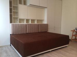 A bed or beds in a room at Modern Studio 20 Meters from Mladost 1 Metro Station