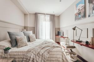 Letto o letti in una camera di Petronio Residence