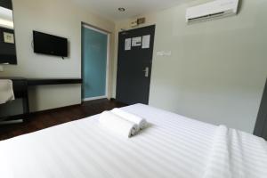 Voodi või voodid majutusasutuse Hotel 99 Bandar Klang (Meru) toas