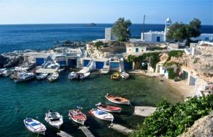 a group of boats are docked in a harbor at Traditional House by the Sea in Mandrakia