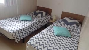 Katil atau katil-katil dalam bilik di Camping Cap Soleil