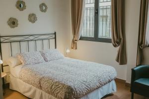 Ένα ή περισσότερα κρεβάτια σε δωμάτιο στο Ronda Navarra by Valdesierra