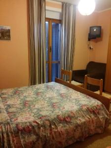 TV a/nebo společenská místnost v ubytování Albergo la Valle