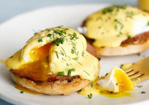 a plate of food with eggs and cheese on it at Windy Harbour restaurant and accommodation in Glossop