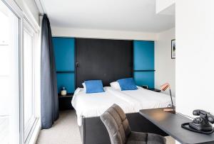 Voodi või voodid majutusasutuse Hotel Nelson toas
