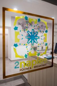 een bord voor een herstelkamer en ontbijt bij 2Naples Rooms in Napels