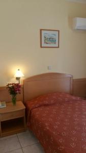 Кровать или кровати в номере Hotel Tolo