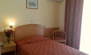 Кровать или кровати в номере Hotel Tolo