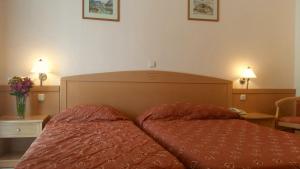 Кровать или кровати в номере Hotel Tolo