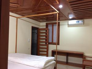 A bed or beds in a room at Huong Sen Homestay