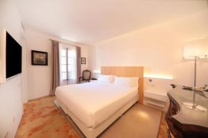 Postel nebo postele na pokoji v ubytování AH Art Hotel Palma