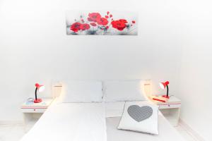 Postel nebo postele na pokoji v ubytování Casa Vacanze Cau