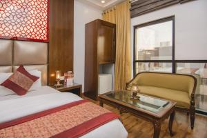 Postel nebo postele na pokoji v ubytování Hotel Sita International