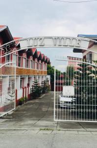 a gate in a parking lot in front of a building at Luzville Residences - C8 in Naic