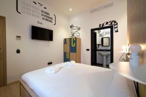 Posteľ alebo postele v izbe v ubytovaní U-Sense For You Hostel Sevilla