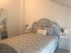 Posteľ alebo postele v izbe v ubytovaní Apartamentos Playa Portonovo