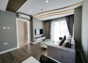 TV a/nebo společenská místnost v ubytování Wisdom Hotel & Residence