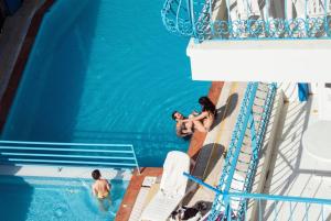 a group of people in a swimming pool on a cruise ship at Marigold Otel in Çeşme +22 photos