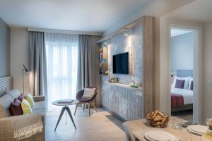 Postel nebo postele na pokoji v ubytování Citadines Arnulfpark Munich