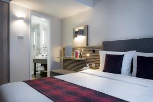Postel nebo postele na pokoji v ubytování Citadines Arnulfpark Munich