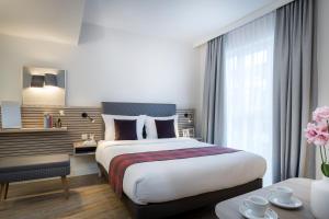 Postel nebo postele na pokoji v ubytování Citadines Arnulfpark Munich + 26 fotografií