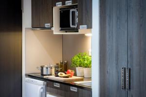 Kuchyň nebo kuchyňský kout v ubytování Citadines Arnulfpark Munich