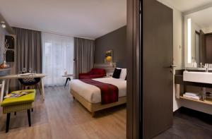 Postel nebo postele na pokoji v ubytování Citadines Arnulfpark Munich