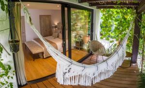 a bed room with a canopy over the top of the bed at Patio del Mundo in Medellín