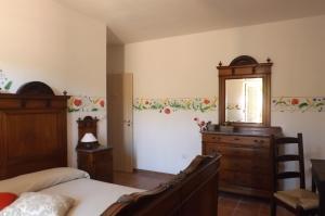 A bed or beds in a room at Poderi Sartoris