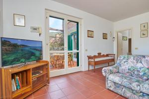Posezení v ubytování Appartamento Via dei Lecci - Residence Sant'Anna