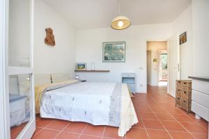 Postel nebo postele na pokoji v ubytování Appartamento Via dei Lecci - Residence Sant'Anna