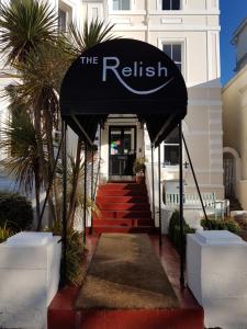 
a red and white staircase leading to a balcony at The Relish in Folkestone
