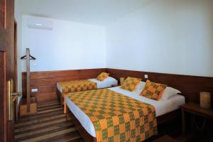 Postel nebo postele na pokoji v ubytování Sweet Guest House