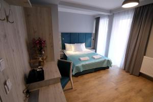 Posteľ alebo postele v izbe v ubytovaní Willa Ponikiewka
