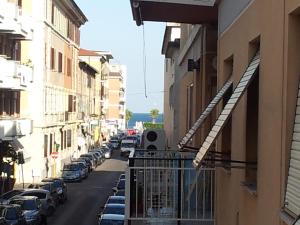 a city street with cars parked on the street at B&B Dimora di Traiano in Terracina