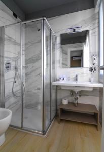 a bathroom with a shower and a sink at Hotel Ristorante Fortuna in Cavallino-Treporti