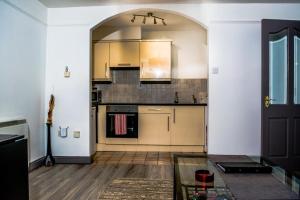 a kitchen with a glass table in a room at Liffey Suite in Dublin