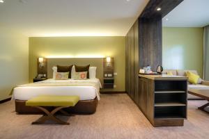 Katil atau katil-katil dalam bilik di Tamarind Tree Hotel