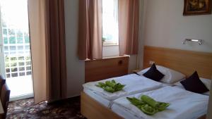 Voodi või voodid majutusasutuse Hotel O.K. 1 toas