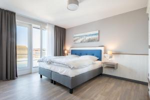 Postel nebo postele na pokoji v ubytování Seegarten Appartements Büsum