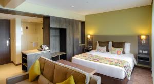 Katil atau katil-katil dalam bilik di Tamarind Tree Hotel