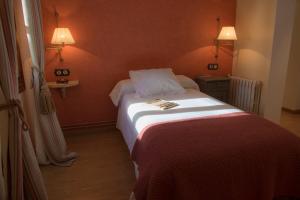 Ein Bett oder Betten in einem Zimmer der Unterkunft Hotel Plaza