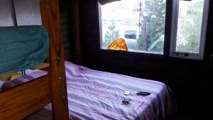 Una cama o camas en una habitación de Hostería de Montaña los Duendes del Volcán