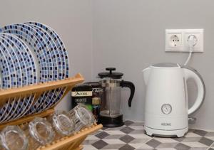 a kitchen counter with a coffee maker and a blender at Home Sweet Home in Athens