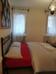 a bedroom with two beds and two windows at Fondamente Nove 5201 in Venice